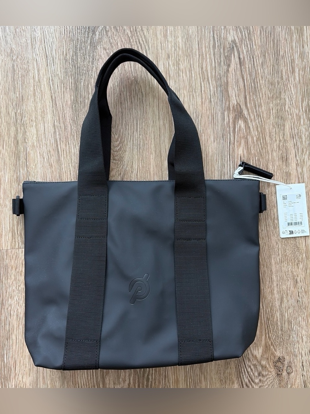 Rains Micro Tote bag with Peloton branding